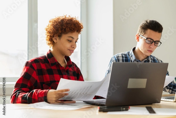 Obraz Diverse colleagues business people working on office. Startup business group working as team to find solution to problem. Happy multiracial corporate professional team discussing project ideas