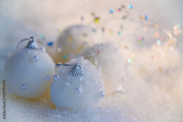 Fototapeta Christmas postcard. New Year, beautiful dark blurred background with white balls with pearls and yellow bokeh