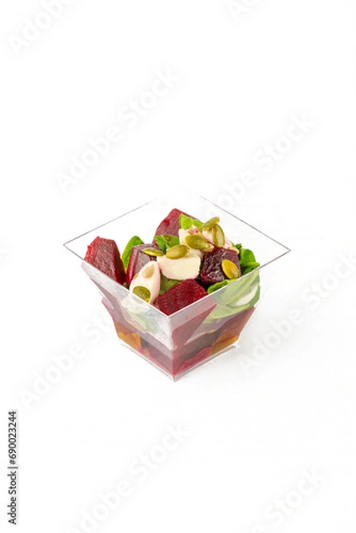 Fototapeta A small portion of vegetable salad on a white background
