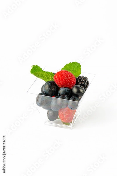 Fototapeta A small portion of fresh berries on a white background