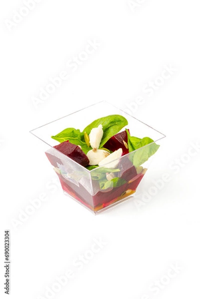 Fototapeta A small portion of vegetable salad on a white background