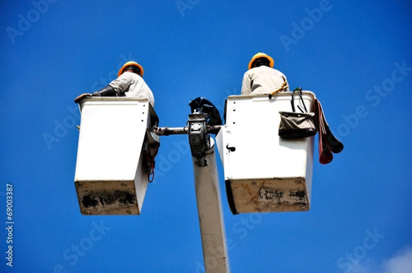 Fototapeta Worker in bucket