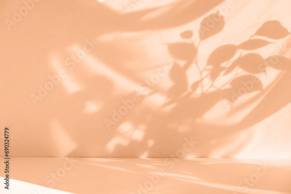 Fototapeta Tropical leaf shadow blank background composition for product presentation. Beautiful trendy peach fuzz color background.