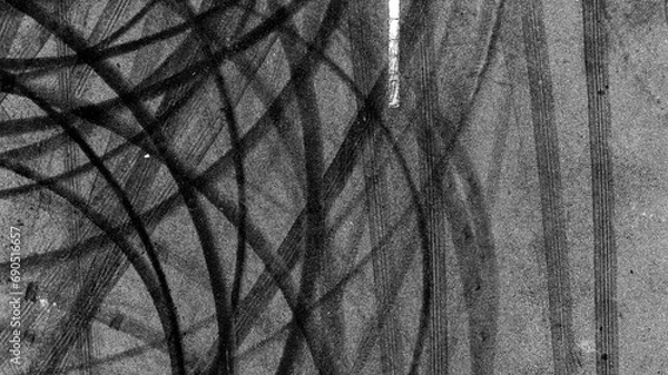 Obraz Aerial top view car tire marks burnout, Tire marks on the asphalt road, Tire mark on race track texture and background.