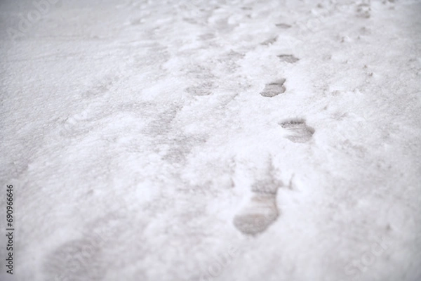 Obraz Deep boot marks on the first snow. The first snow that a man walked through, leaving footprints.