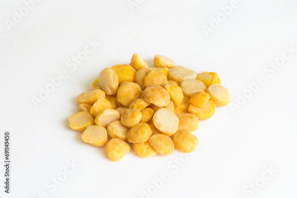 Obraz Heap of yellow split chickpeas on white background