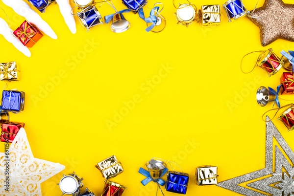 Fototapeta Christmas background. New Year banner Template with gift boxes, stars, bells, toys, decorations. Bright Christmas frame. Copy space. Winter holidays New Year. Top view photo for message or advertising