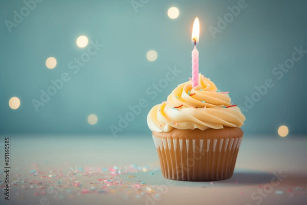 Fototapeta cupcake with festive burning pink candle