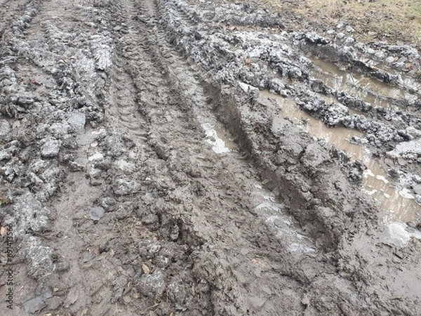 Fototapeta Texture of tracks from a bulldozer on the dirt. Tread on mud.