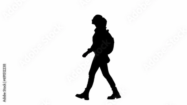 Fototapeta Portrait of traveler isolated on white background alpha channel. Silhouette of woman in glasses walking with backpack and looking around.