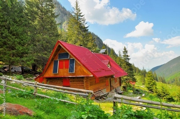 Obraz Wooden mountain rescue chalet with solar panels