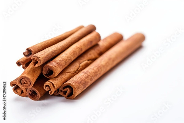 Obraz Cinnamon sticks isolated on white background.