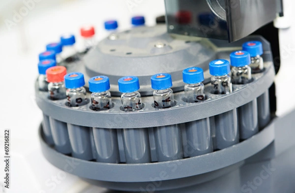 Fototapeta Close-up little laboratory flasks in cartridge