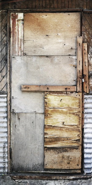 Obraz old shaky wooden door