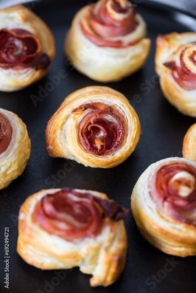 Obraz Puff pastry swirls. Close-up of puff pastry with prosciutto.