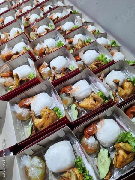 Fototapeta rice boxes arranged on the table