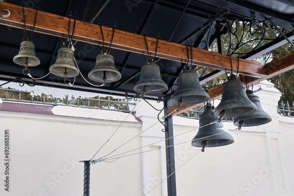 Fototapeta bells and religious symbols made from metal 