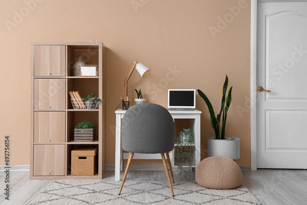 Fototapeta Stylish interior of modern room with comfortable workplace