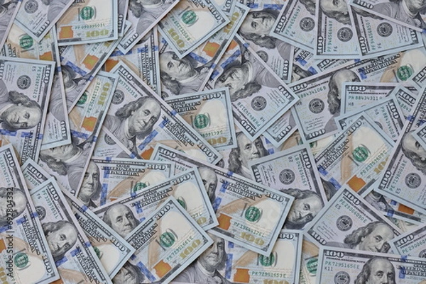 Fototapeta Very big amount of US hundred dollar bills close up. Huge quantity of united states currency notes on flat table