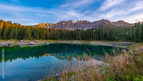 Obraz Lago di Carezza, emerald waters, mystical Spruce forests, Latemar mountain views. A picturesque gem in South Tyrol and the Dolomites' favorite