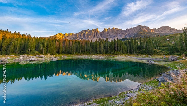 Obraz Lake Carezza in Val d'Ega, Mermaid legend gives it rainbow hues. Changing depths, frozen charm in winter