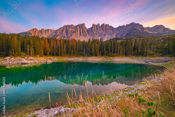 Obraz Lago di Carezza,Emerald waters, misty forests, Latemar views, an enchanting Alpine canvas. A beloved South Tyrol gem, guide for essential tips