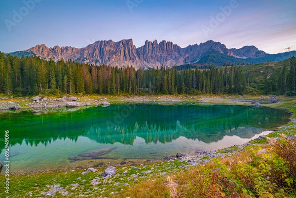 Obraz Lago di Carezza, Emerald waters, misty forests, Latemar views, an Alpine masterpiece. Beloved in South Tyrol, explore the guide for essential tips