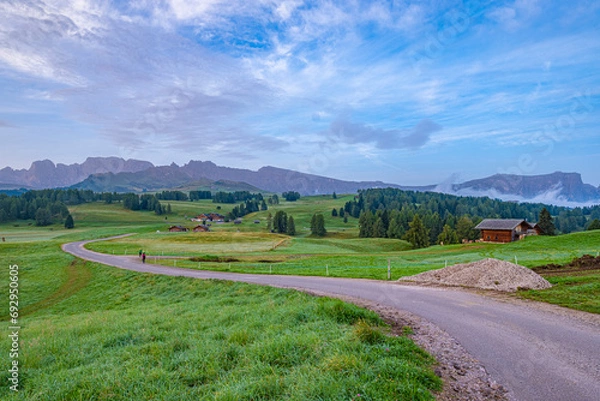 Obraz Alpe di Siusi, Europe's largest alpine pasture, UNESCO World Heritage. Summer promises vibrant blooms, peak climbs, and rustic hut retreats
