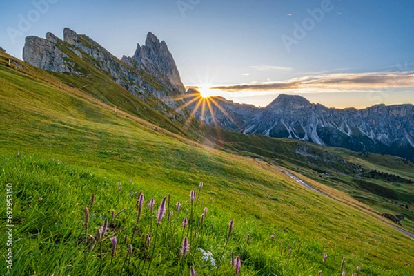 Obraz Golden sunrise at Seceda, Dolomites, A breathtaking spectacle unfolds, bathing the meadows in warm hues, creating a serene and radiant morning panorama
