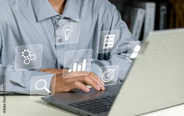 Fototapeta document management system concept, Businessman working on laptop with virtual screen. Process automation to efficiently manage files. Online documentation database.