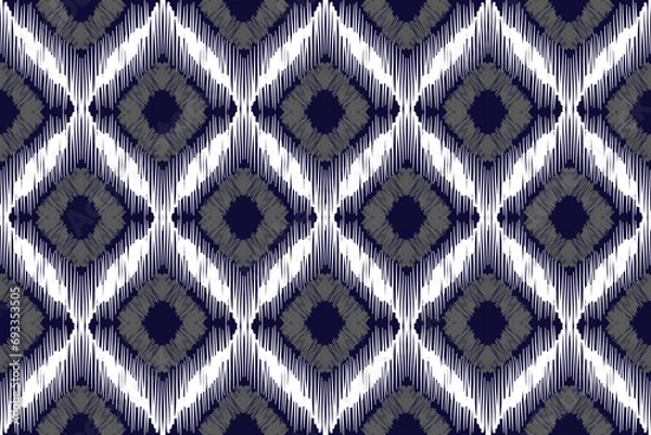 Fototapeta Ikat pattern . Geometric chevron abstract illustration, wallpaper. Tribal ethnic vector texture. Aztec style. Folk embroidery. Indian, Scandinavian, African rug.design for carpet,sarong  