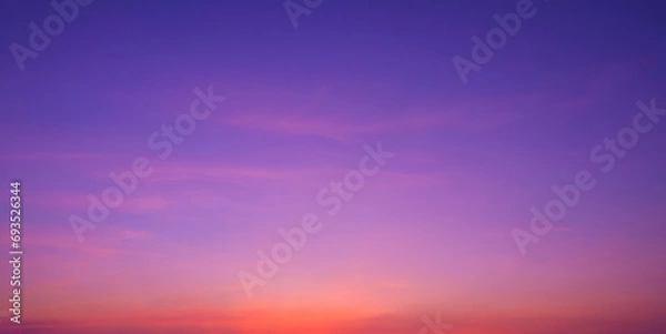 Fototapeta Colorful romantic twilight sky with beautiful pink sunset cloud and orange sunlight on dark blue sky after sundown in evening time, idyllic peaceful nature panoramic background