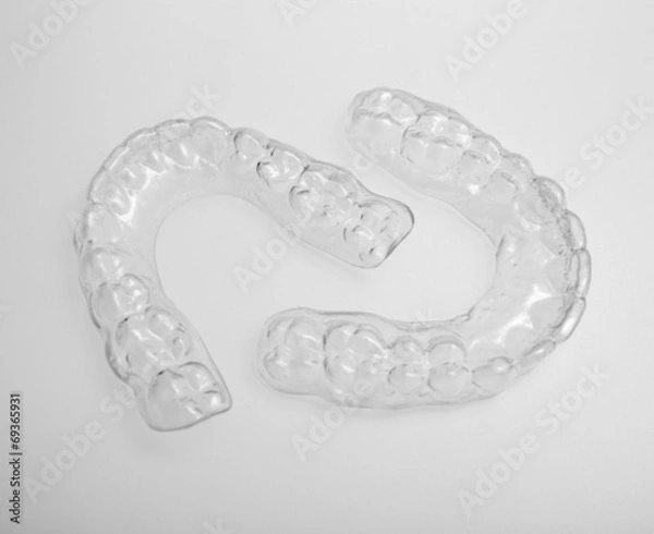 Obraz Translucent upper and lower essix retainers on a gray background
