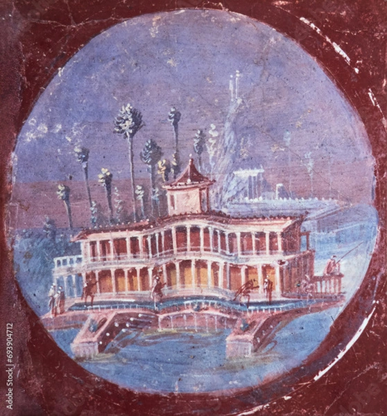 Fototapeta ancient Roman villa in fresco on a red background in a Domus of Pompeii, Pompeii buried by the volcanic eruption of Vesuvius in 79 AD