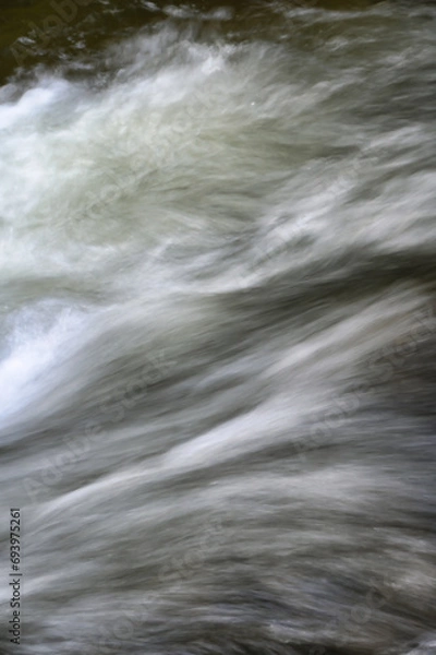 Obraz water flowing over rocks