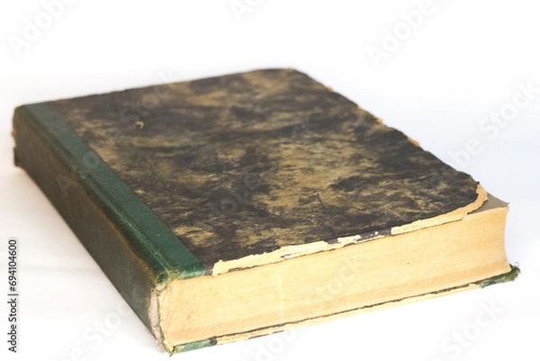 Obraz Vintage book in hard cover, white background, selective focus