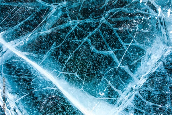 Obraz Top vies of a texture cracks transparent ice on a Baikal lake on a snowy winter day 