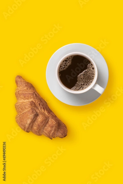 Fototapeta Top view image of сoffee and croissant breakfast on yellow background, minimalism art, flat lay, copy space