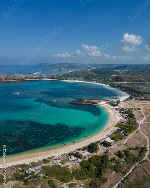 Fototapeta Drone photo of the southern coast of Lombok Island. Pantai Tanjung Aan Beach. Sunny day. Turquoise water. Lombok. Indonesia