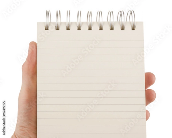 Obraz Hand holding an empty notepad (notebook) isolated on white