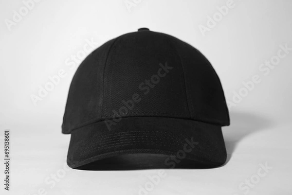 Obraz Stylish black baseball cap on white background