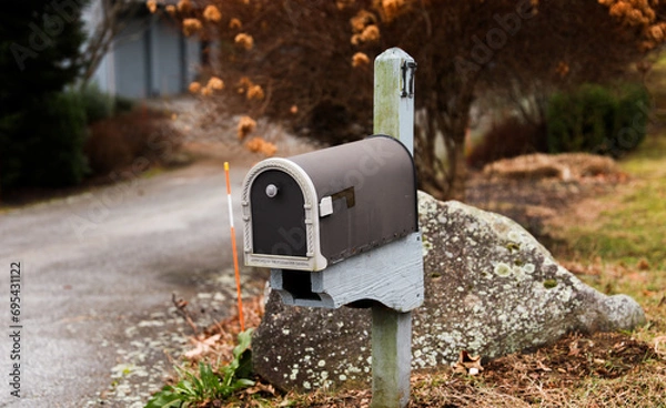 Fototapeta mailbox outside suburban home, symbolizing communication and connection