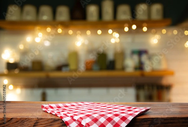 Obraz Empty wooden deck table and red checked tablecloth over mint wallpaper background. High quality photo