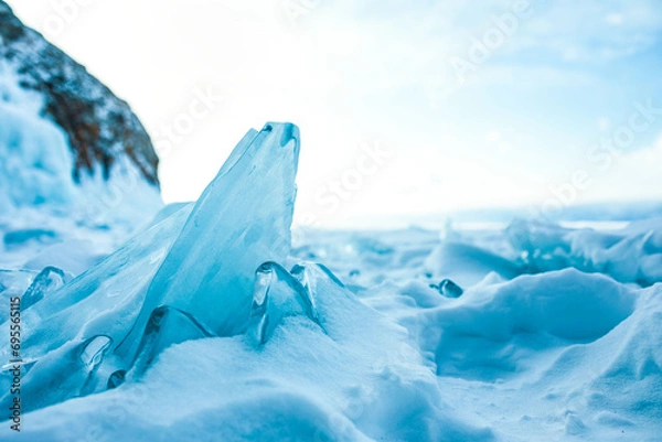 Obraz Beautiful view of a small cracked ice floe on frozen Baikal lake in evening time 