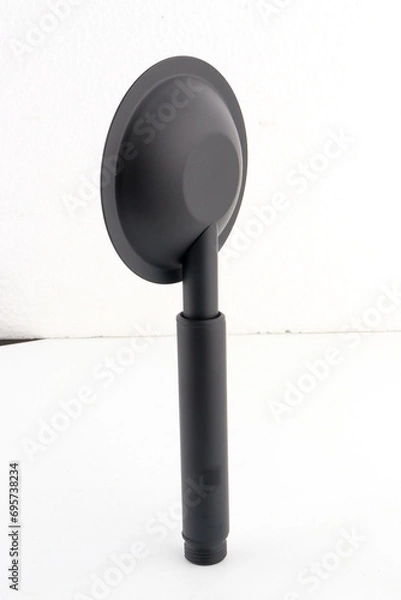 Fototapeta The black hand shower features a sleek, modern design that adds a stylish touch to any bathroom.