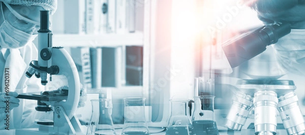 Obraz Double exposure microscope and Young woman scientific using equipment in the laboratory for research.Biotechnology,development,chemical,vaccine,Photo concept experimentation and research.
