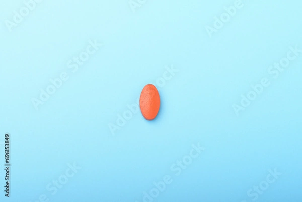 Obraz Concept of healthcare and medicine. Top view, copy space , Medicine pills, tablets . Close up of red pills on blue background. Pills background. Free space for design.