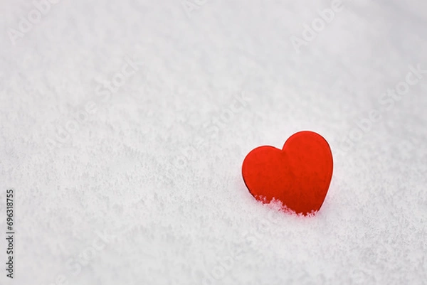 Fototapeta valentines day background, red glass heart on white fresh snow, love symbol