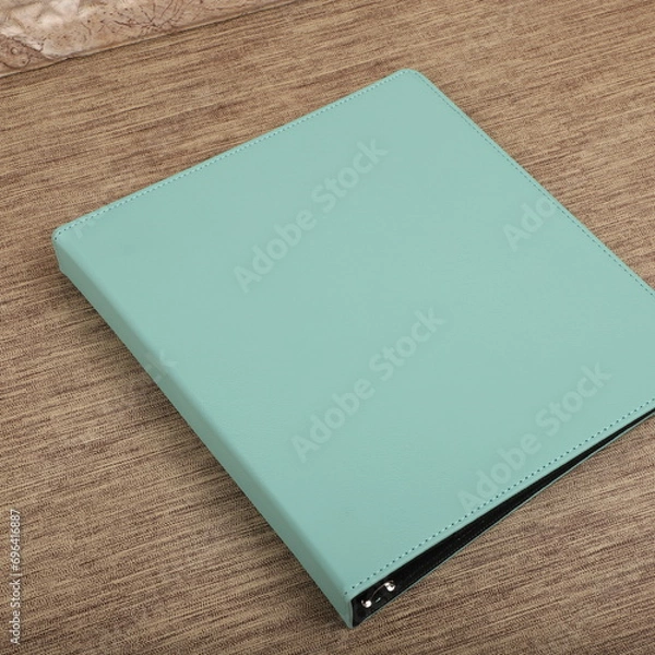 Fototapeta Personalized binding, leather folder cover, leather binding, binder, binder, office binding, corporate gift. Concept shot leather binding, top view, colorful