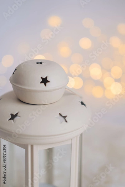 Fototapeta Christmas lantern with bokeh lights on white background. Festive decoration.